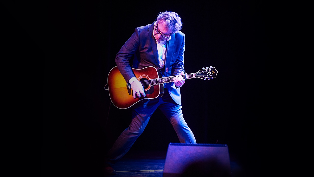 Steven Page performs with acoustic guitar on stage at Forest Festival