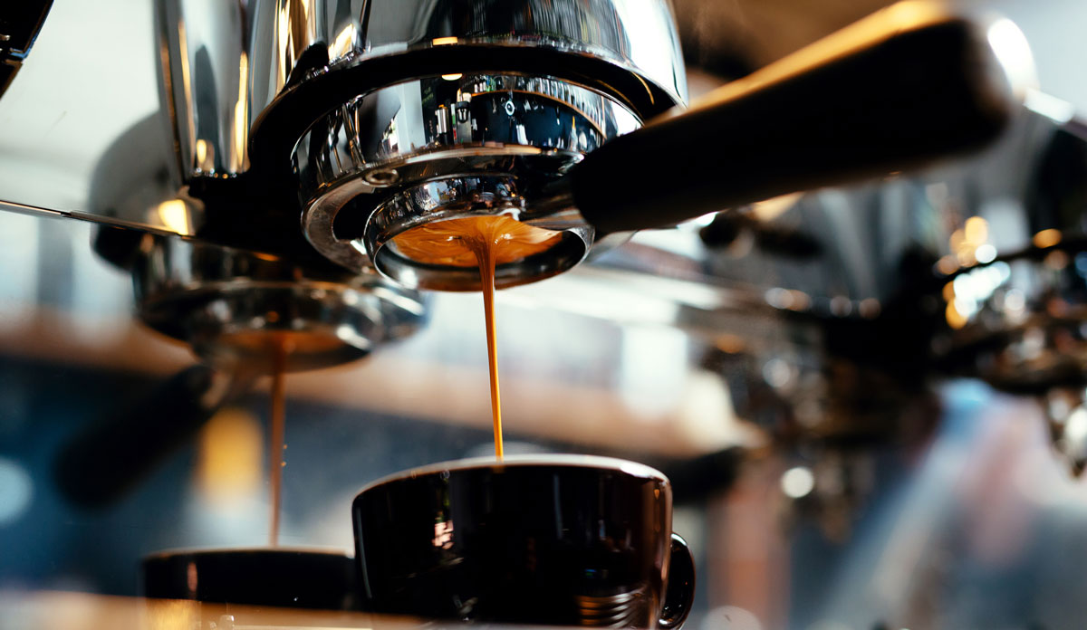 Espresso machines making coffee