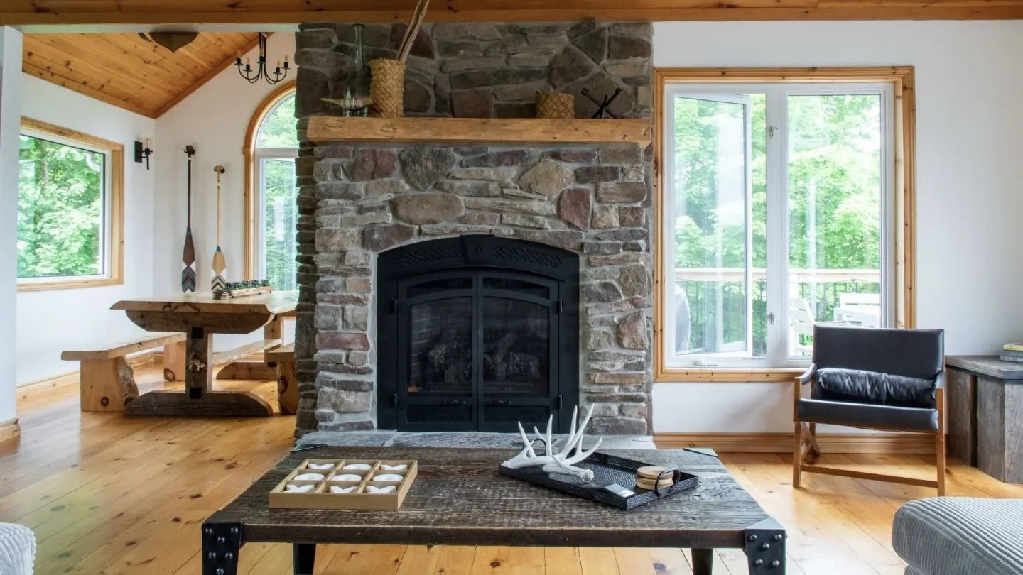 H2h Cottage Co. on Kennisis Lake luxury Haliburton cottage rentals living area with real fireplace